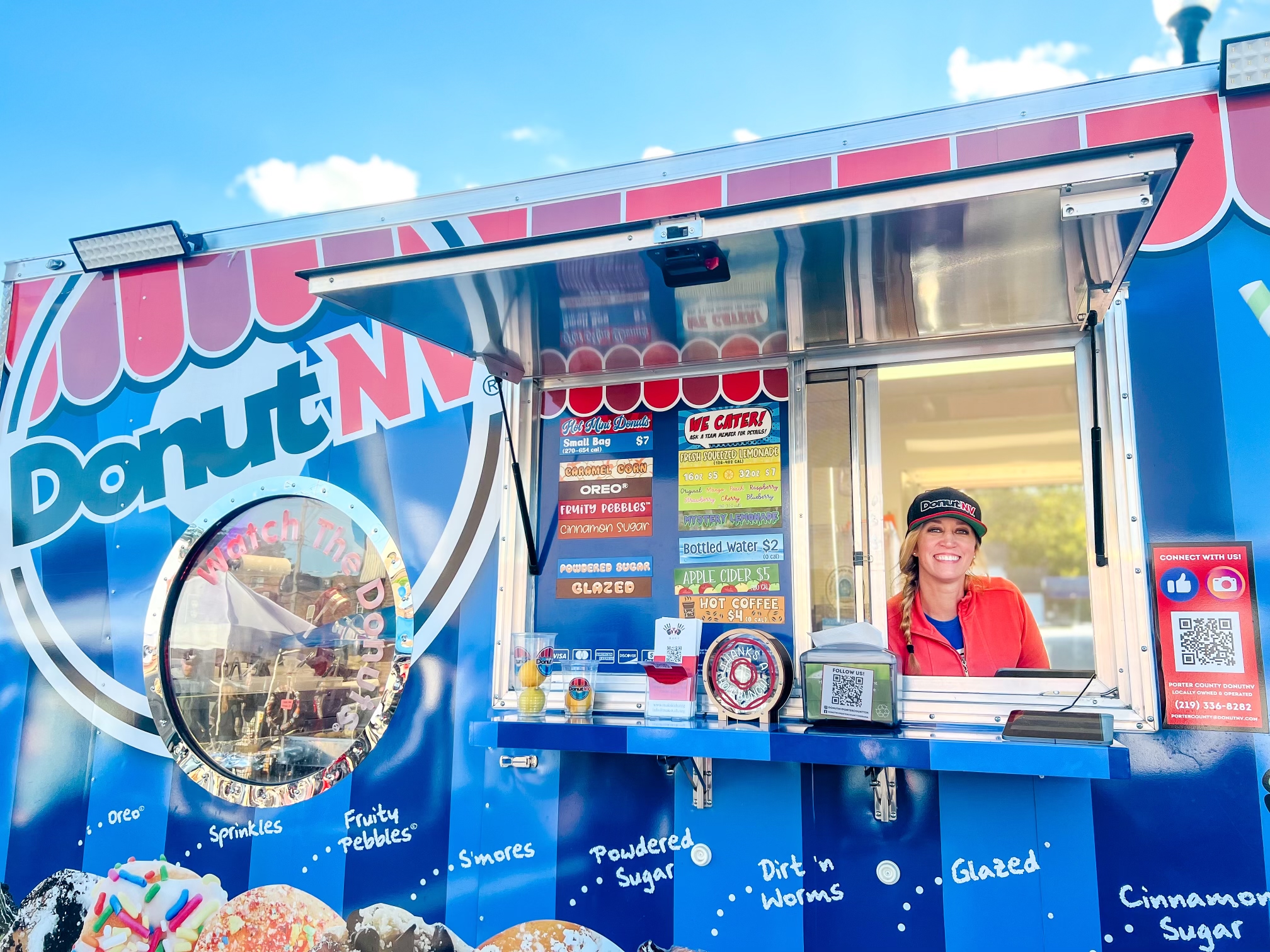 DonutNV franchisee operator at window on a sunny day