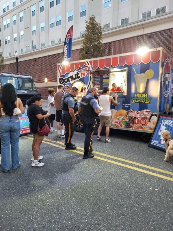 Police officers and community members at DonutNV trailer
