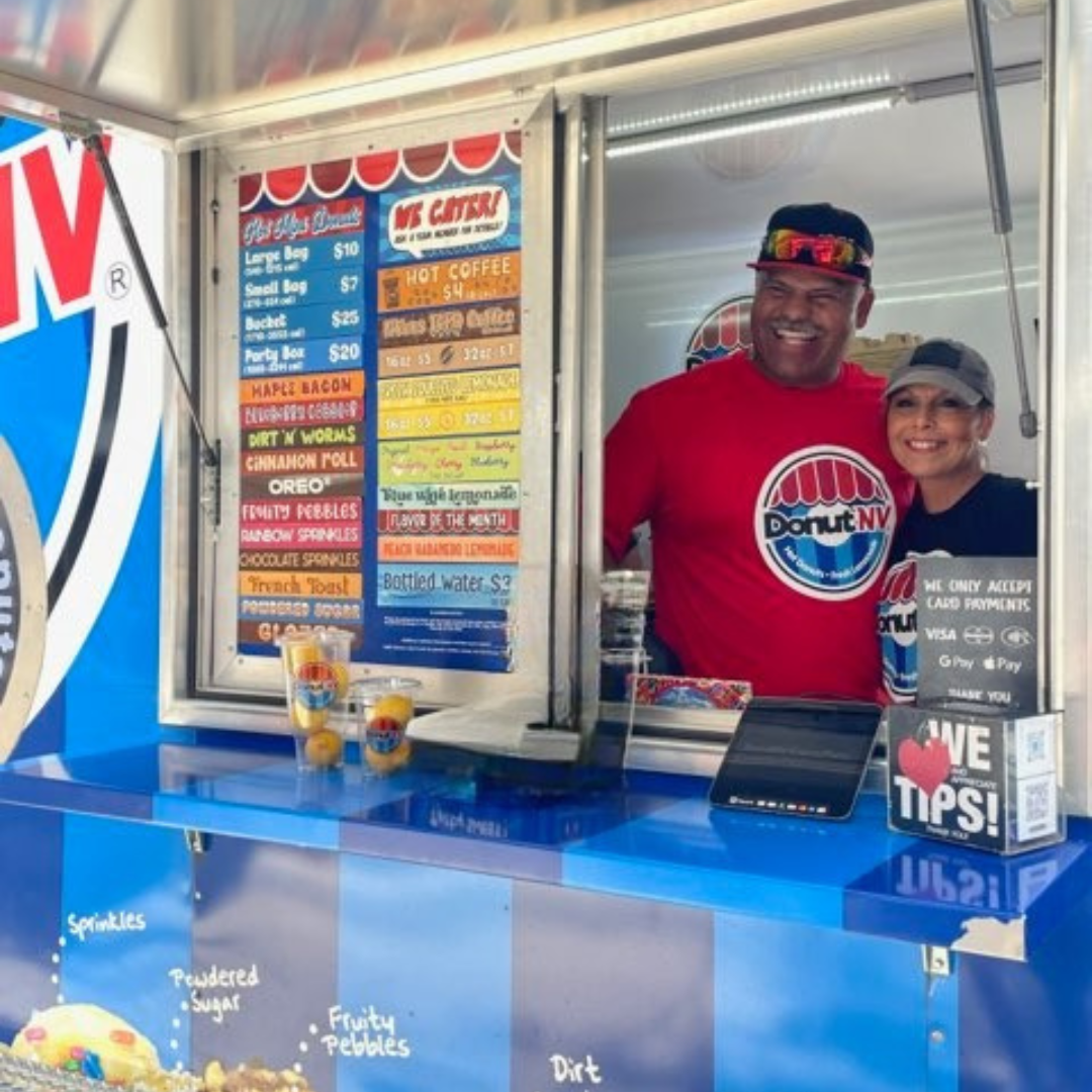 DonutNV franchisee couple smiling at service window