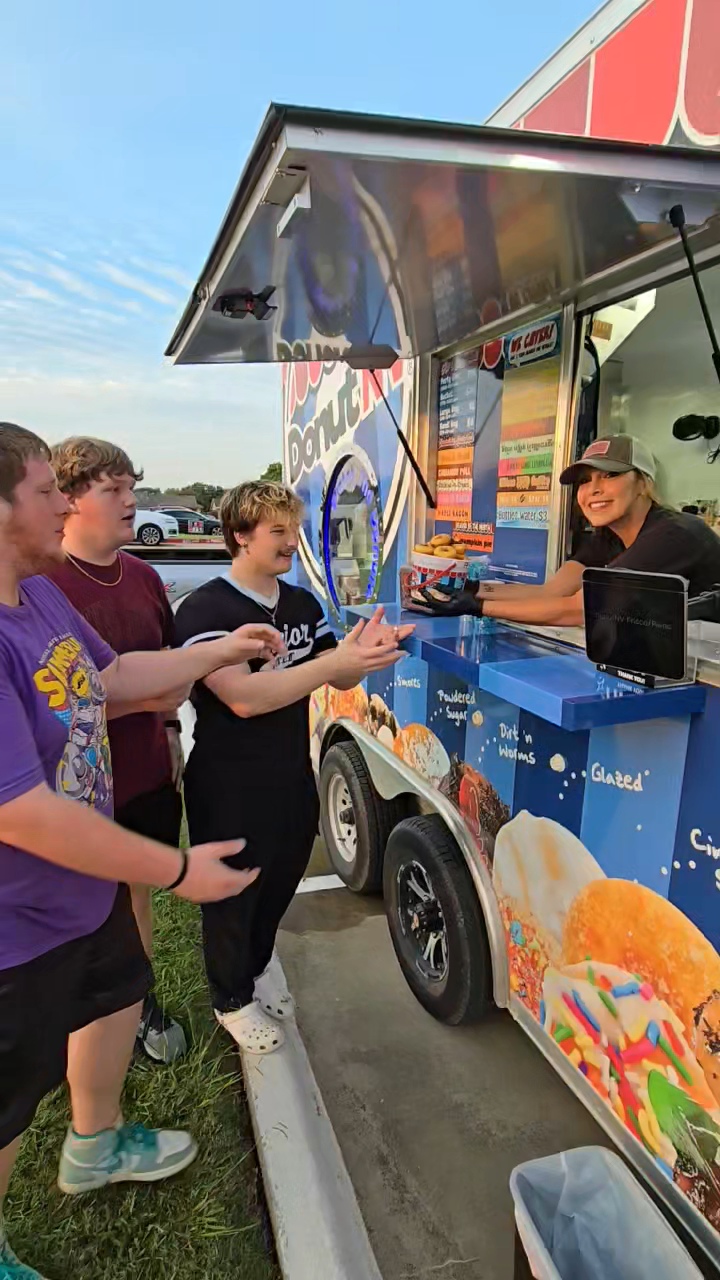 Teenagers ordering at DonutNV during golden hour